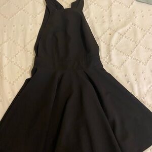Black mini dress with bow detail and open back